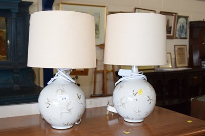 Lot 276 - A pair of modern porcelain based table lamps...