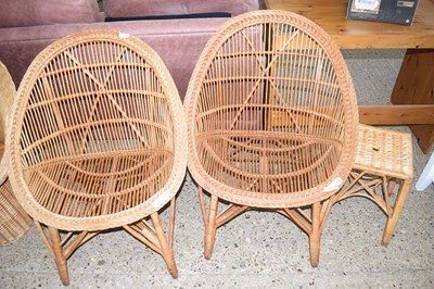 Lot 285 - A pair of wicker armchairs and a footstool (3)