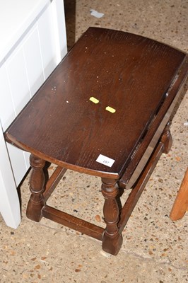 Lot 287 - A dark oak drop leaf coffee table