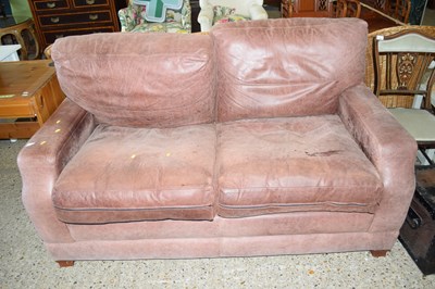 Lot 295 - A leather two seater sofa