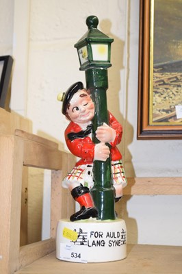 Lot 534 - A musical "For Auld Lang Syne" figurine