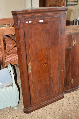 Lot 327 - A Georgian oak wall mounted corner cabinet