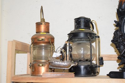 Lot 634 - Two lamps and a white metal ship on stand
