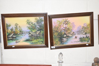 Lot 655 - A pair of tropical boat scenes, framed