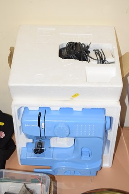 Lot 672 - A small sewing machine, boxed