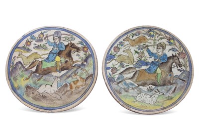 Lot 100 - A pair of Qajar plaques decorated with...