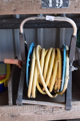 Lot 415 - A hose reel together with hose