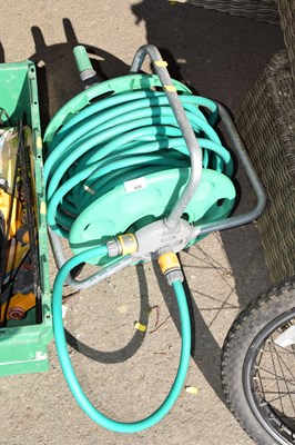 Lot 428 - A hose reel together with a quantity of hose