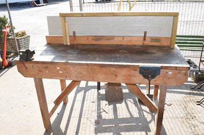 Lot 436 - A heavy duty work bench together with two vices