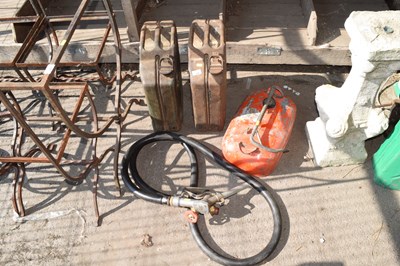 Lot 438 - Two jerry cans together with a fuel pump hose...