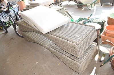 Lot 449 - Two rattan garden sun loungers together with...