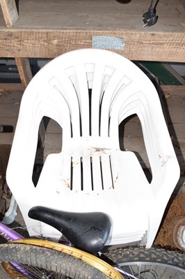 Lot 457 - Four plastic garden chairs
