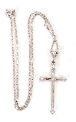 Lot 105 - An 18ct white gold and diamond cross necklace,...