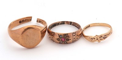Lot 230 - Three gold rings: to include a ruby and seed...