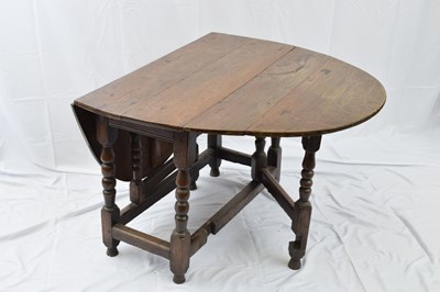 Lot 243 - Small oak drop leaf dining table in the 18th...
