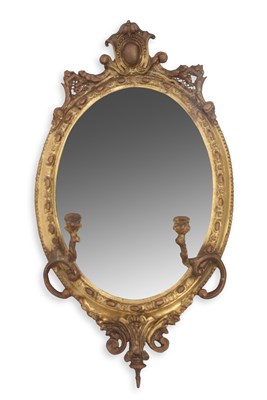 Lot 330 - A George III wall mirror set in an oval frame...