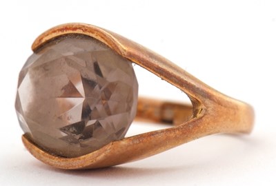 Lot 10 - A 9ct smokey quartz ring, the oval smokey...