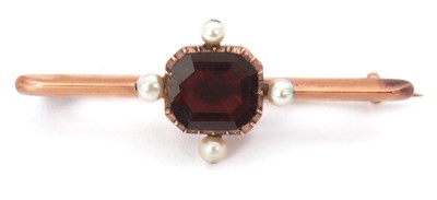 Lot 90 - A garnet and cultured pearl brooch, the...