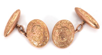Lot 211 - A pair of 10ct cufflinks, the oval and torpedo...