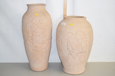 Lot 15 - A pair of large unglazed vine decorated vases
