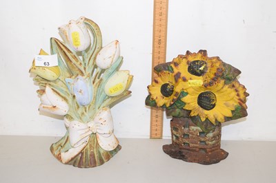 Lot 63 - Two floral cast iron door stops
