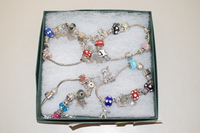 Lot 123 - A group of four white metal bracelets