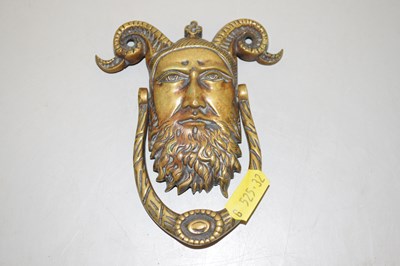 Lot 136 - A brass door knocker modelled as a Satyrs head