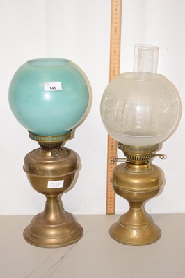 Lot 145 - Two brass based oil lamps
