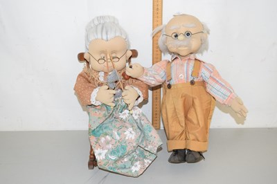 Lot 180 - A pair of fabric dolls modelled as an elderly...