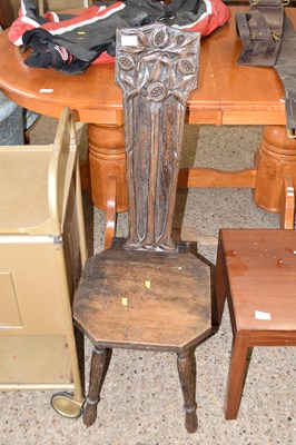 Lot 314 - A carved oak weavers chair