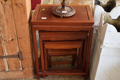 Lot 327 - A nest of Oriental hardwood tables