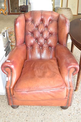 Lot 330 - Brown leather button back armchair