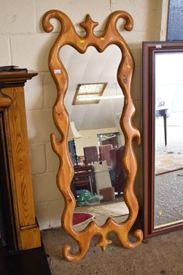 Lot 351 - A wall mirror with abstract wooden frame