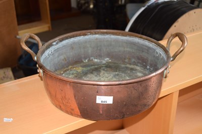 Lot 845 - A copper double handled pan