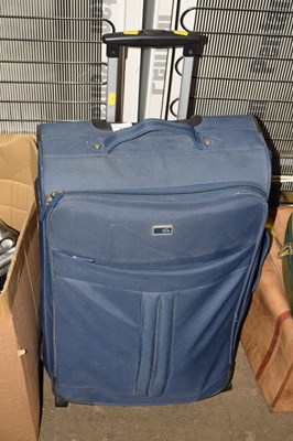 Lot 879 - A suitcase and a quantity of lawn bowls
