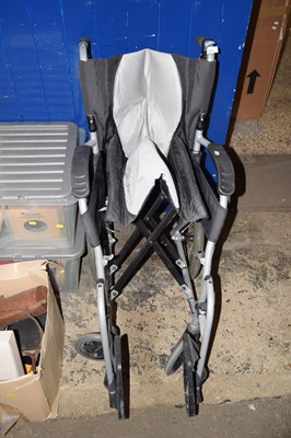 Lot 875 - A folding wheelchair