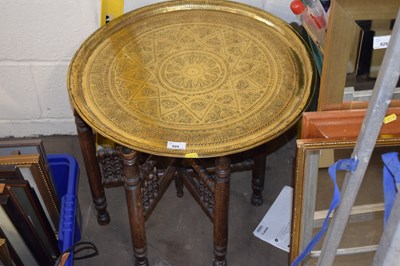 Lot 924 - A brass topped folding table