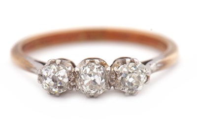 Lot 71 - A three stone diamond ring, the three old mine...