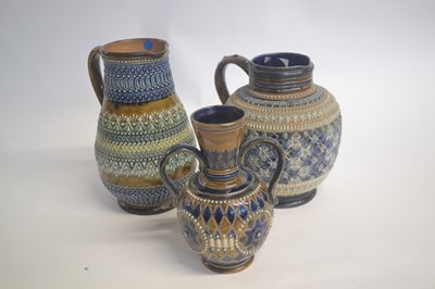 Lot 364 - DOULTON LAMBETH JUGS APPLIED FLORAL DESIGNS; 19TH CENTURY