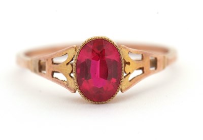 Lot 6 - A synthetic ruby ring, the oval synthetic ruby...