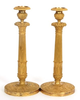 Lot 314A - Pair of French gilt candlesticks decorated in...