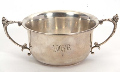 Lot 6 - A George V twin handled silver bowl of plain...