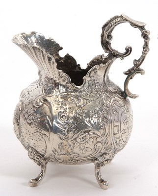 Lot 9 - An antique French white metal cream jug, circa...