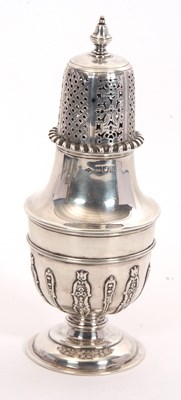 Lot 11 - An Edwardian silver caster, the body with a...