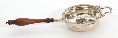 Lot 12 - An Elizabeth II silver tea strainer having a...