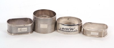 Lot 15 - A group of three silver serviette rings, two...
