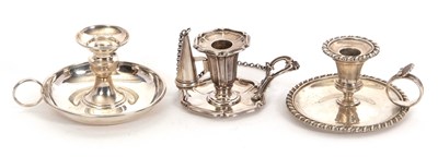 Lot 30 - A group of three small silver chamber sticks...