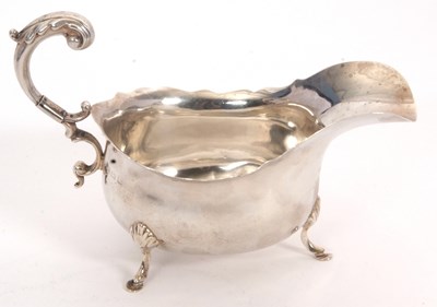 Lot 35 - A George V silver sauce boat of typical form...