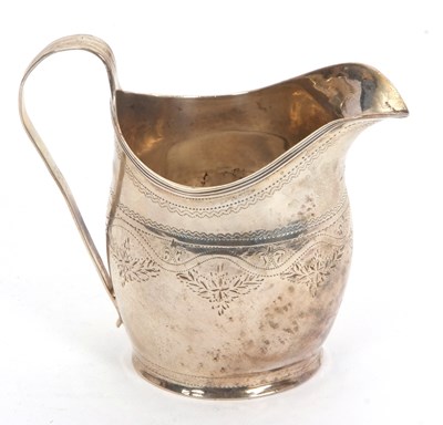 Lot 41 - A George II silver cream jug of helmet shape...