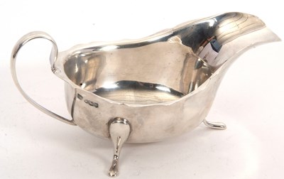 Lot 51 - A George V silver sauce boat of typical form,...